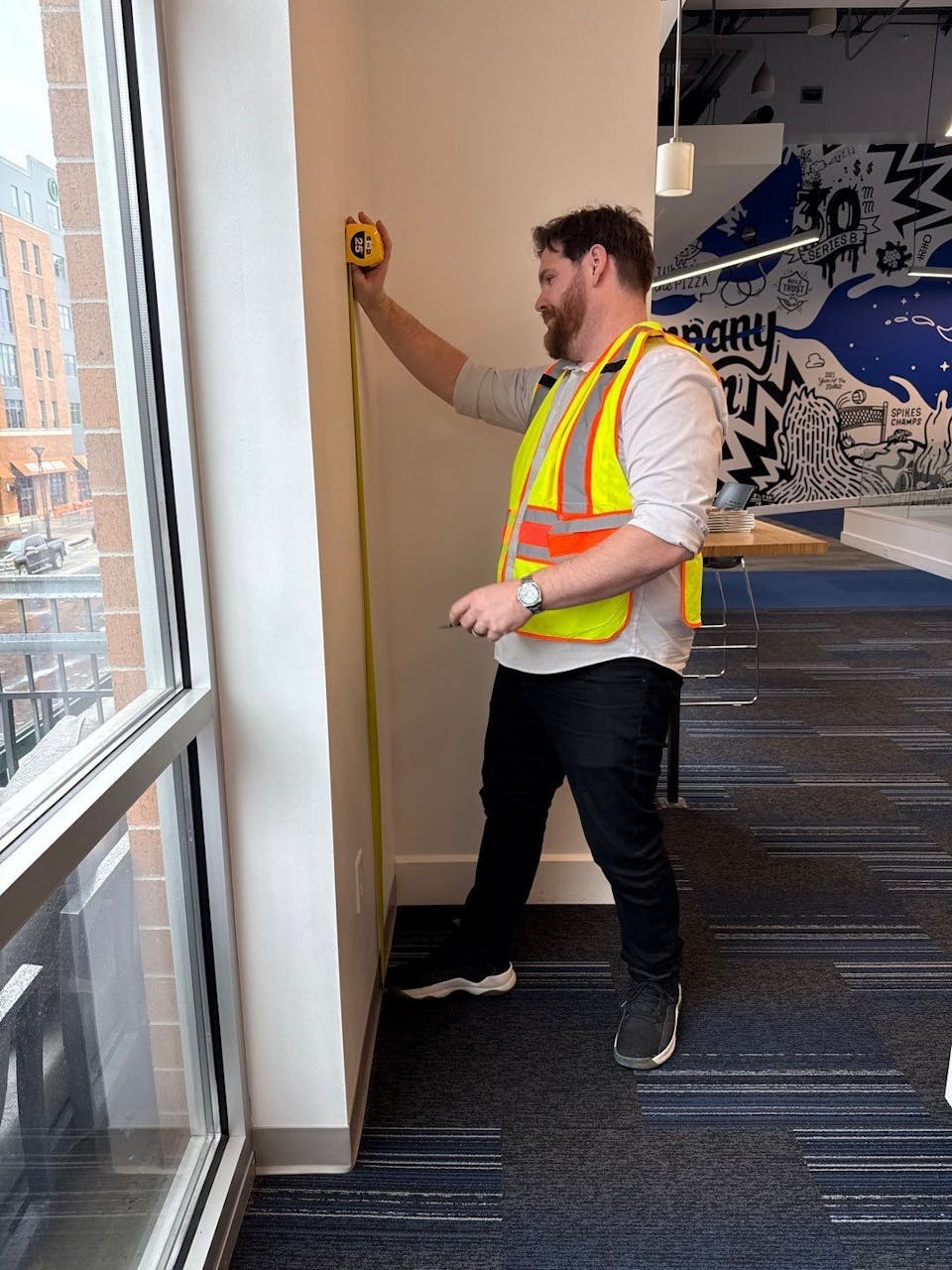 caleb measuring with tape measure