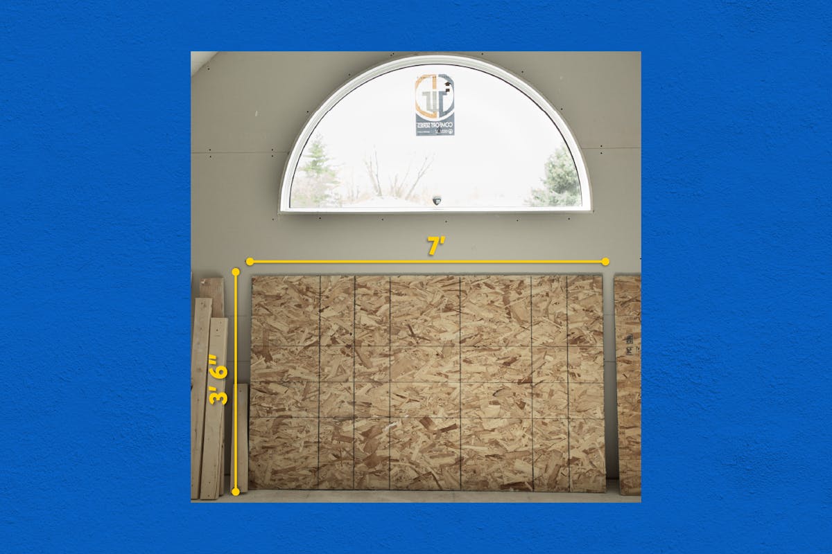 Framed plywood wall measured using CompanyCam LiDAR Mode, showing in-camera dimensions of 7 feet wide by 3 feet 6 inches tall for accurate material planning.